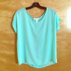Light blue top.