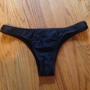 Cheeky black swim suit bottoms