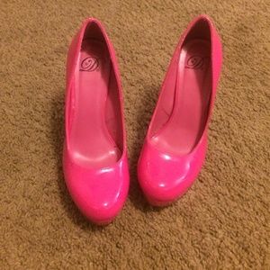Neon pink pumps
