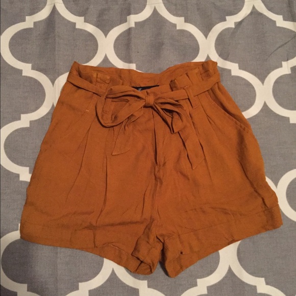 Gold high waisted shorts.