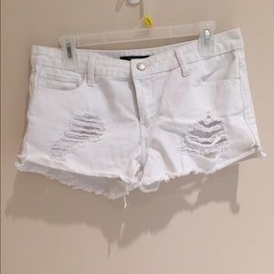 Distressed white shorts.