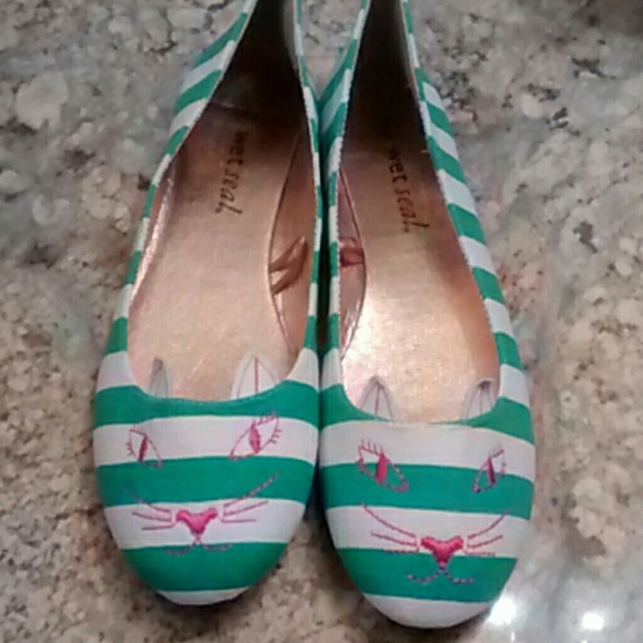 Green and white cat flats