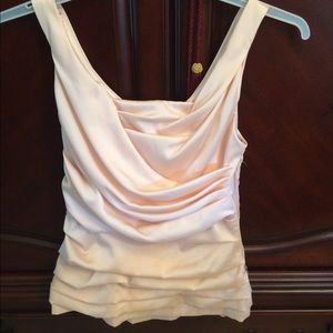 Express peach top with ruching detail.