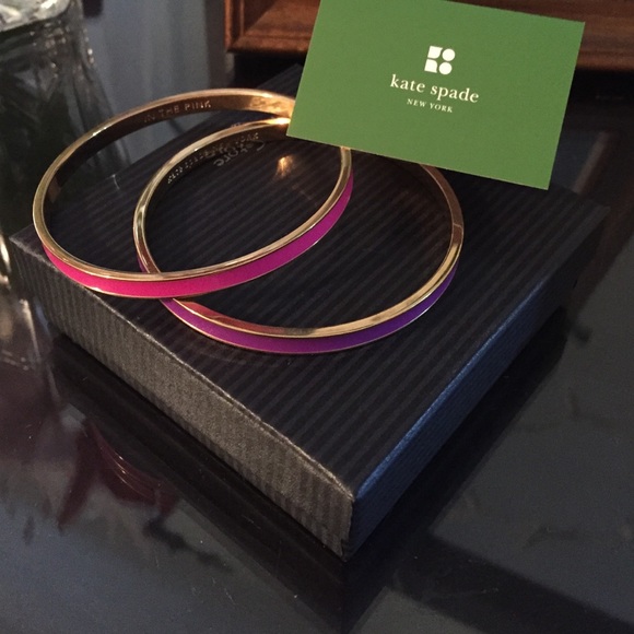 One purple and one pink Kate spade bangle