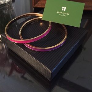 One purple and one pink Kate spade bangle