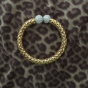 Gold bracelet with diamond balls at the ends