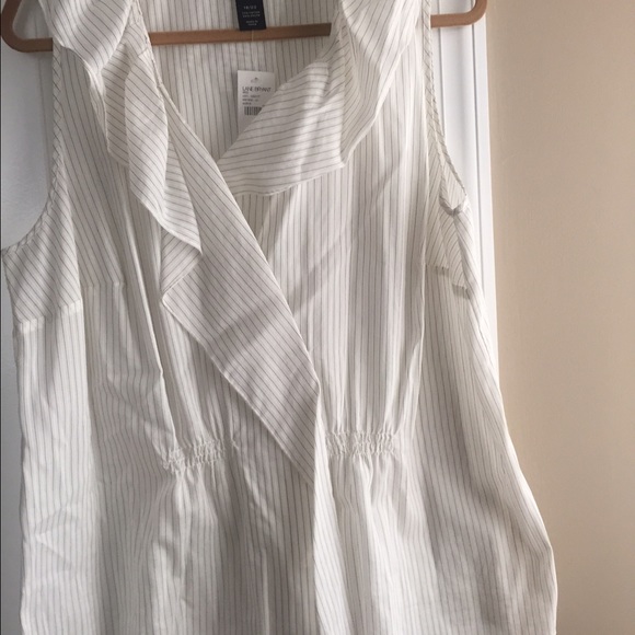 Ruffle sleeveless top. White w/ black stripes.