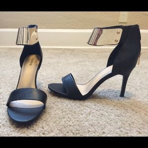 Torrid black heels with gold strap.