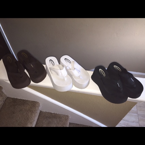 Brown, white and black flip flops
