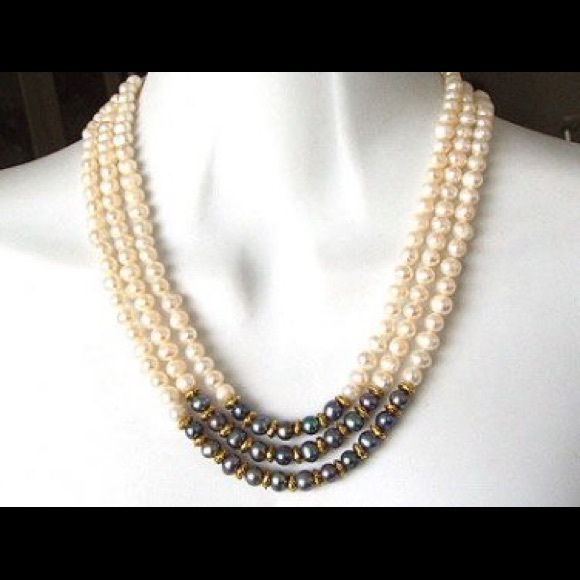 Triple strand pearls w/ black pearls & gold accent
