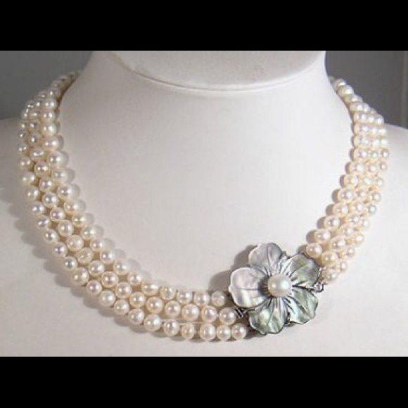 Three string pearl necklace with floral clasp