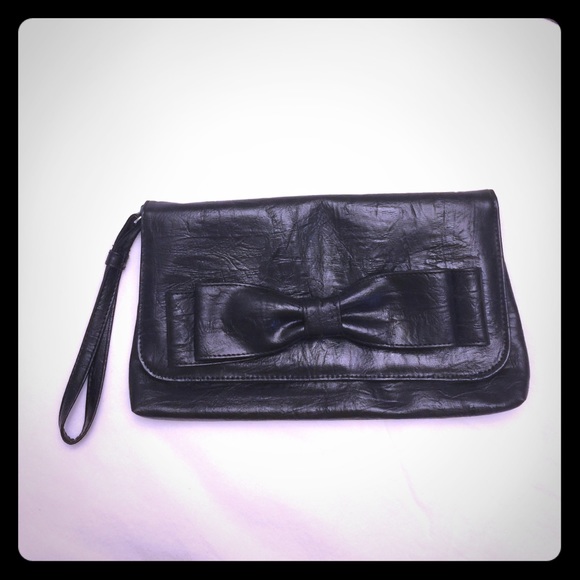 New clutch black with a bow on it
