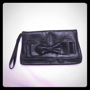 New clutch black with a bow on it
