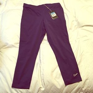 Purple Nike tights.