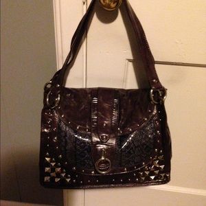 Purple stud handbag