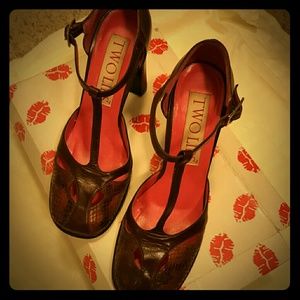 COGNAC/Brown leather heals, snake skin sections.