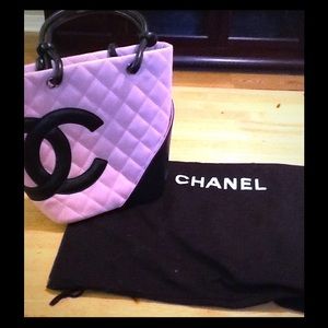 Chanel handbag with dust cover.