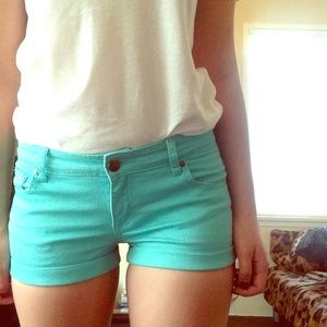 Lightly distressed turquoise shorts