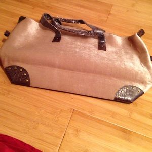 Roomy champagne colored travel bag