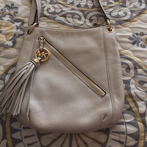 Michael Kors cream colored cross-body w/ tassel