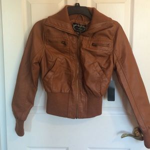 a chocolate brown leather jacket.