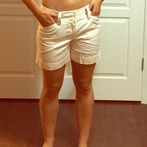 White Bermuda shorts.