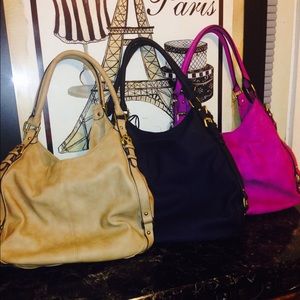 Bundle of three stylish faux leather hand bags.