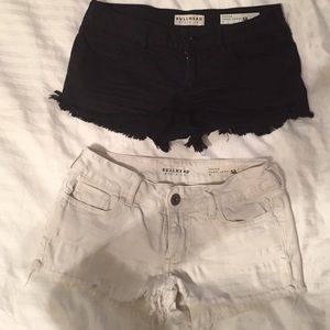 Black and white pair bullhead short shorts