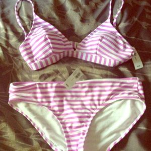 Lavender and white striped swim suit.