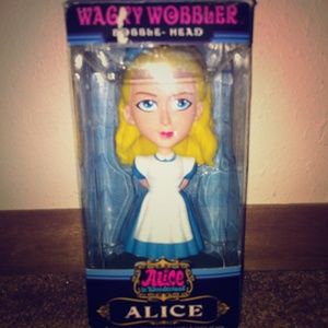 Alice in wonderland figurine.