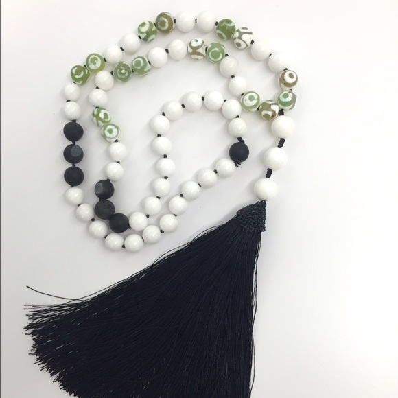 Long tassel necklace with green evil eye beads