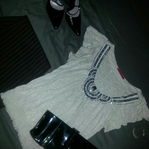 Embellished cream blouse.