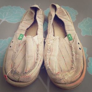 Sanuk beach shoes.
