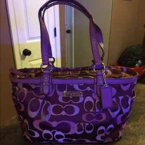 Dark with light purple coach handbag.