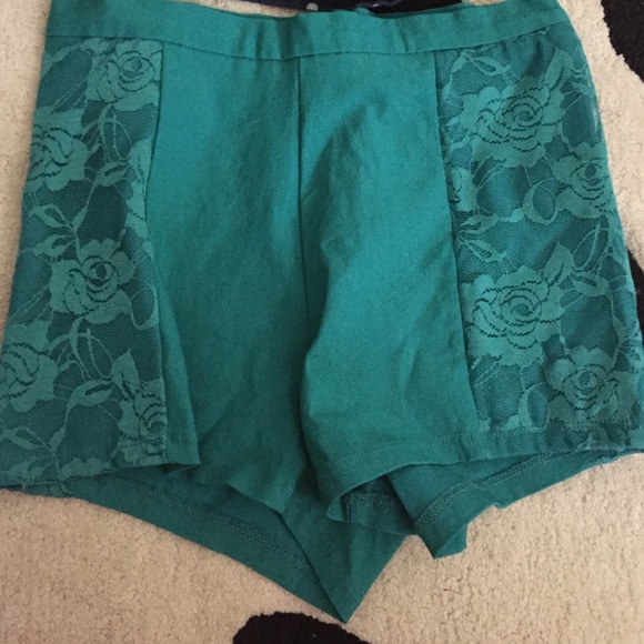 Teal spandex shorts with lace detail.