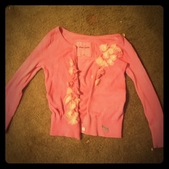 A pink cardigan