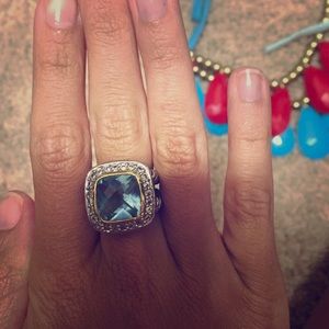 Silver ring with blue topaz stone