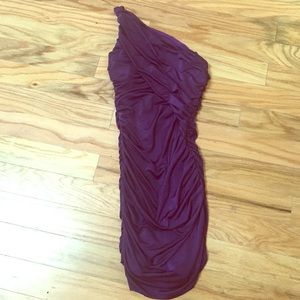 Purple one shouldered dress.