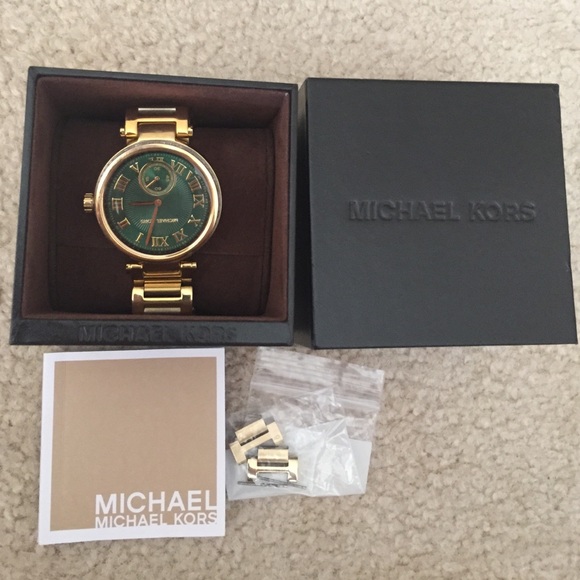 Female gold Michael Kors watch.