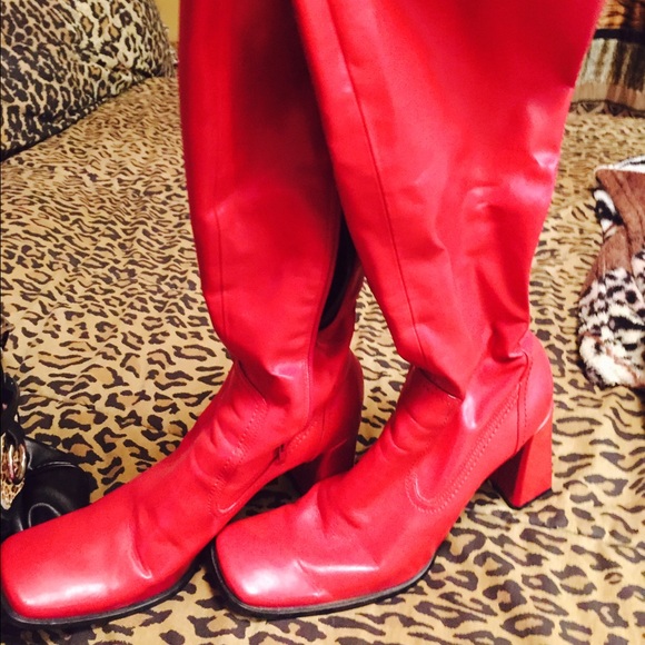 Sexy, red, shiny mid-calf boots with zippers.