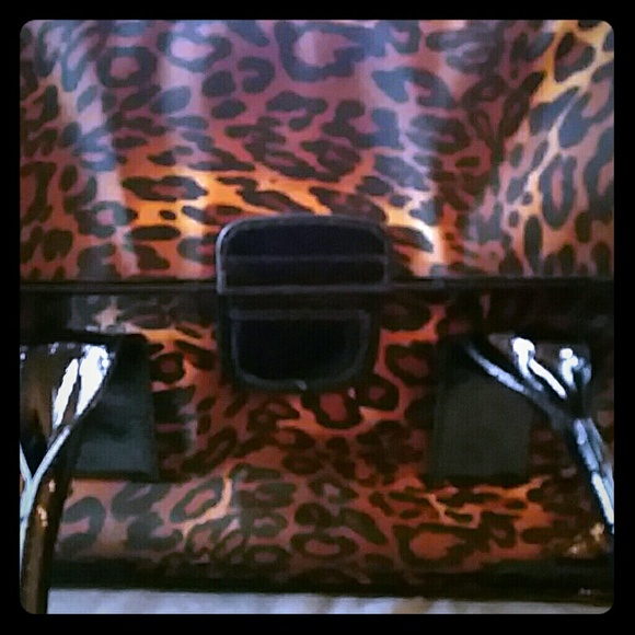 Chico's leopard purse with fire engine red inside