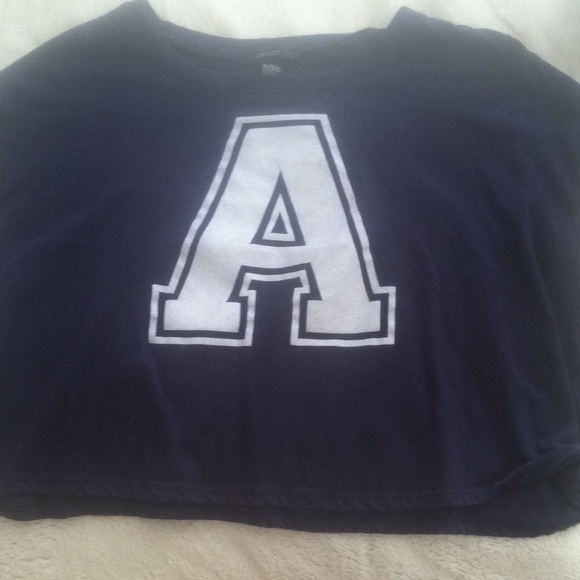 navy blue t shirt. with an A on the front