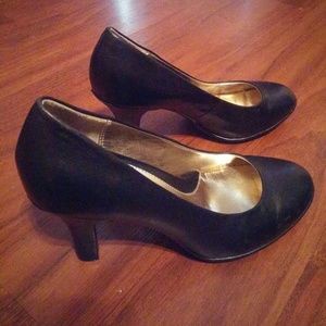 Black leather pumps