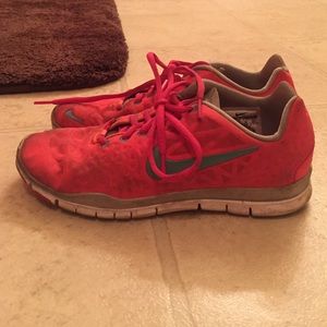 Bright orange and blue nike free run shoes