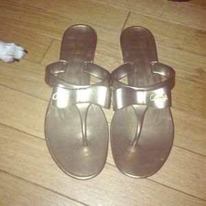 Like new coach gold flip flops
