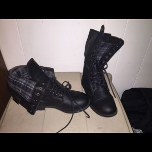Black fold over combat boots.