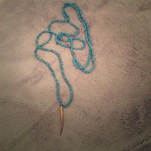 Wrap around horned necklace with blue beads