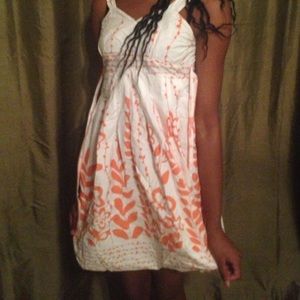 White dress with orange floral pattern