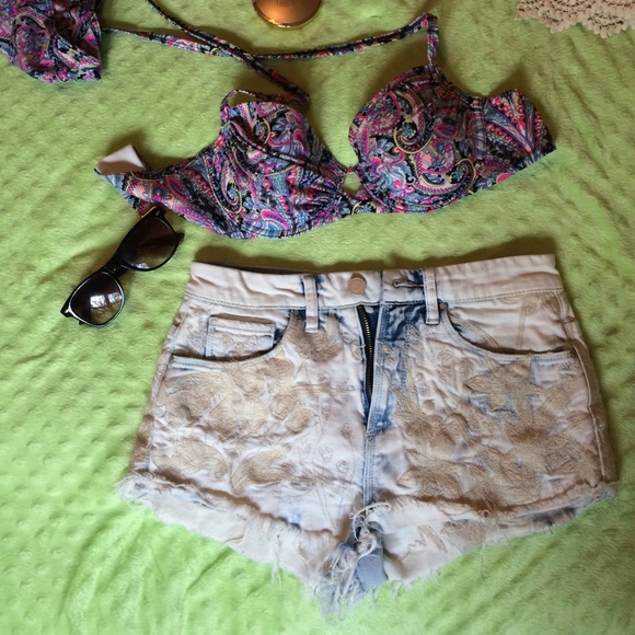 White distressed jeancutoffs with lace detail