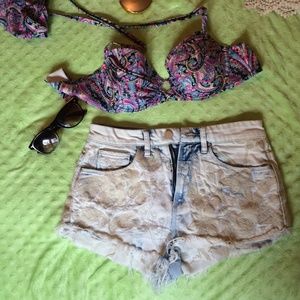 White distressed jeancutoffs with lace detail